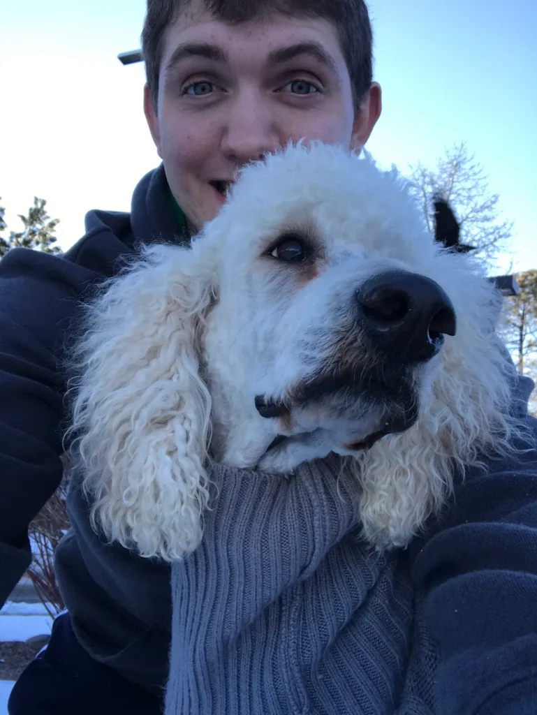 Man with his white dog