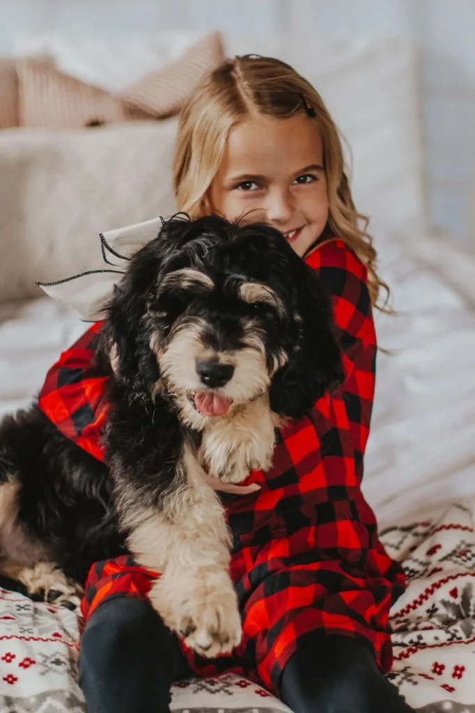Little girl hugging a puppy