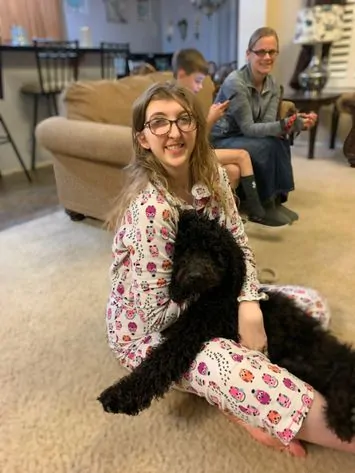 One of our past puppies with Rebecca.